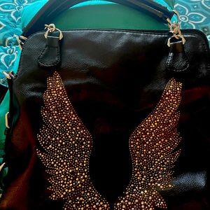 Angel Shoulder Bag. Like new zipper top. Has shoulder strap and two handles